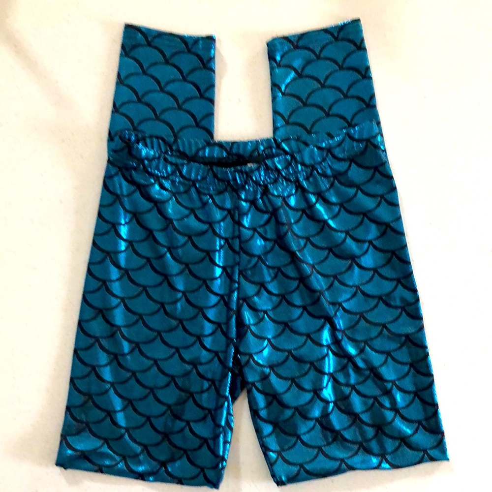 Shimmery aqua blue and black leggings with a mermaid scales pattern